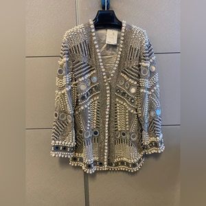 Pearl and mirror embellished jacket.